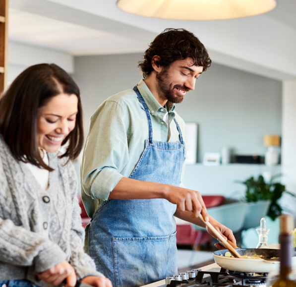 A couple cooking a healthy meal in the kitchen