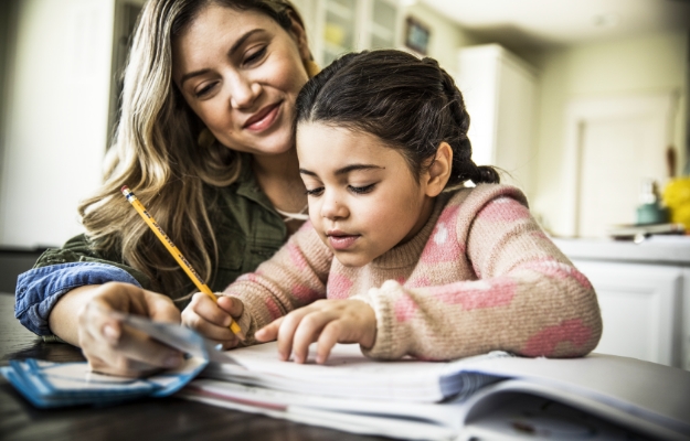 Mother helping child with homework