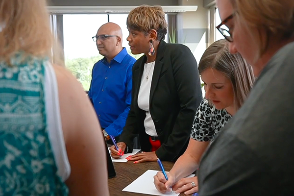 Group of employees engaged in discussion