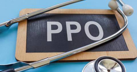 a stethoscope lays on top of a sign reading PPO